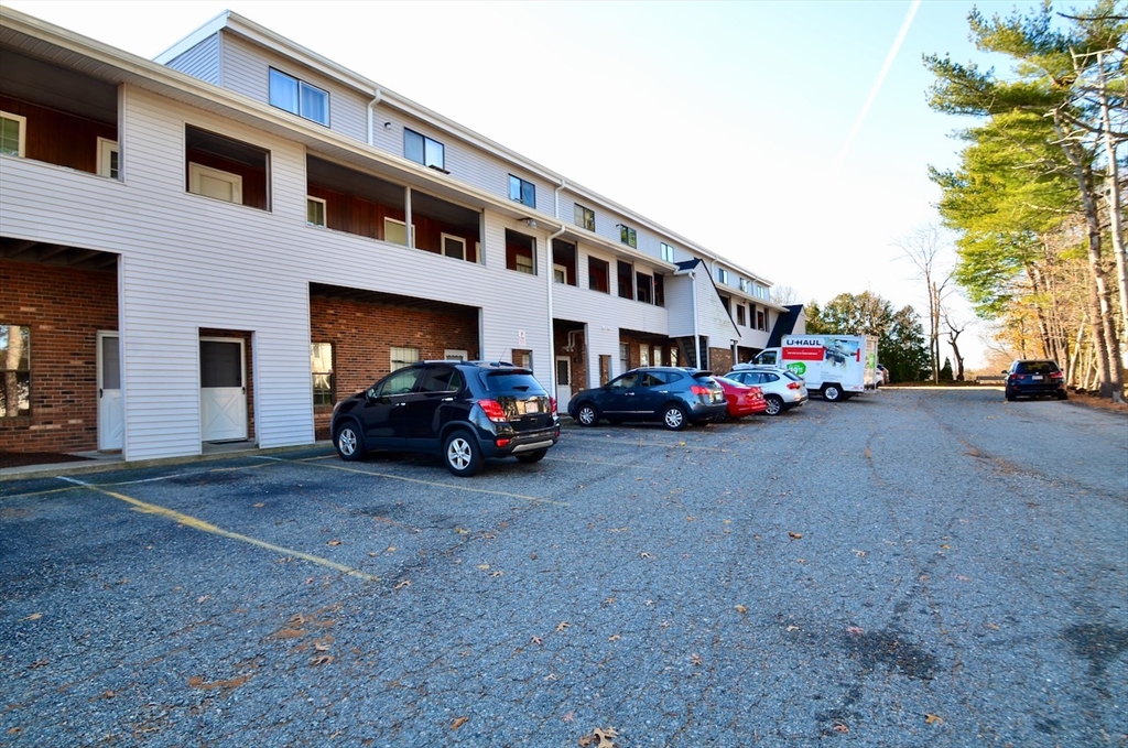 444 Woodward Road, Unit 32 North Providence, RI 02904 - Photo 14 of 15 a view of a cars parked in front of a building