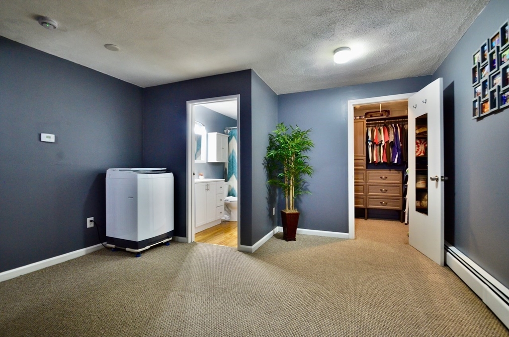 444 Woodward Road, Unit 32 North Providence, RI 02904 - Photo 8 of 15 an empty room with windows and closet