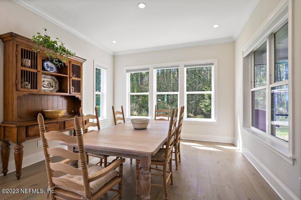 367 Shadow Cove St. Johns, FL 32259 - Photo 11 of 73 a view of a dining room with furniture window and wooden floor