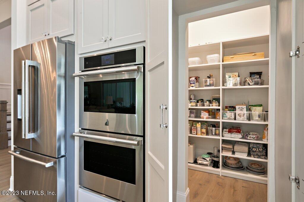 367 Shadow Cove St. Johns, FL 32259 - Photo 19 of 73 a kitchen with stainless steel appliances and cabinets