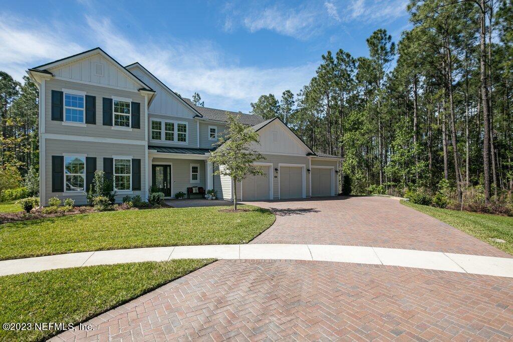 367 Shadow Cove St. Johns, FL 32259 - Photo 2 of 73 a front view of house with yard and green space