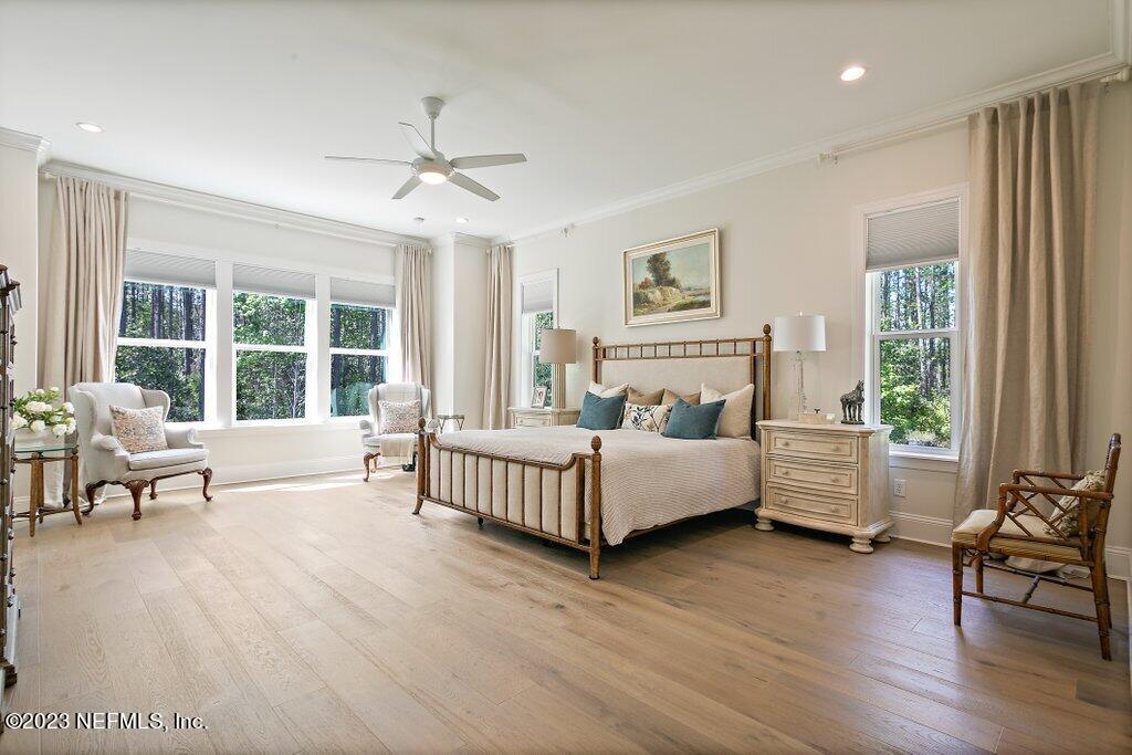 367 Shadow Cove St. Johns, FL 32259 - Photo 27 of 73 a spacious bedroom with a bed and a large window