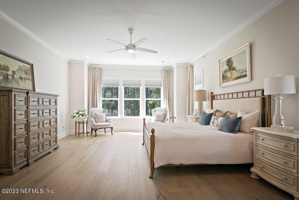 367 Shadow Cove St. Johns, FL 32259 - Photo 28 of 73 a bedroom with a large bed couch and a window