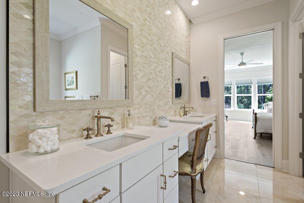 367 Shadow Cove St. Johns, FL 32259 - Photo 31 of 73 a bathroom with a sink and a mirror