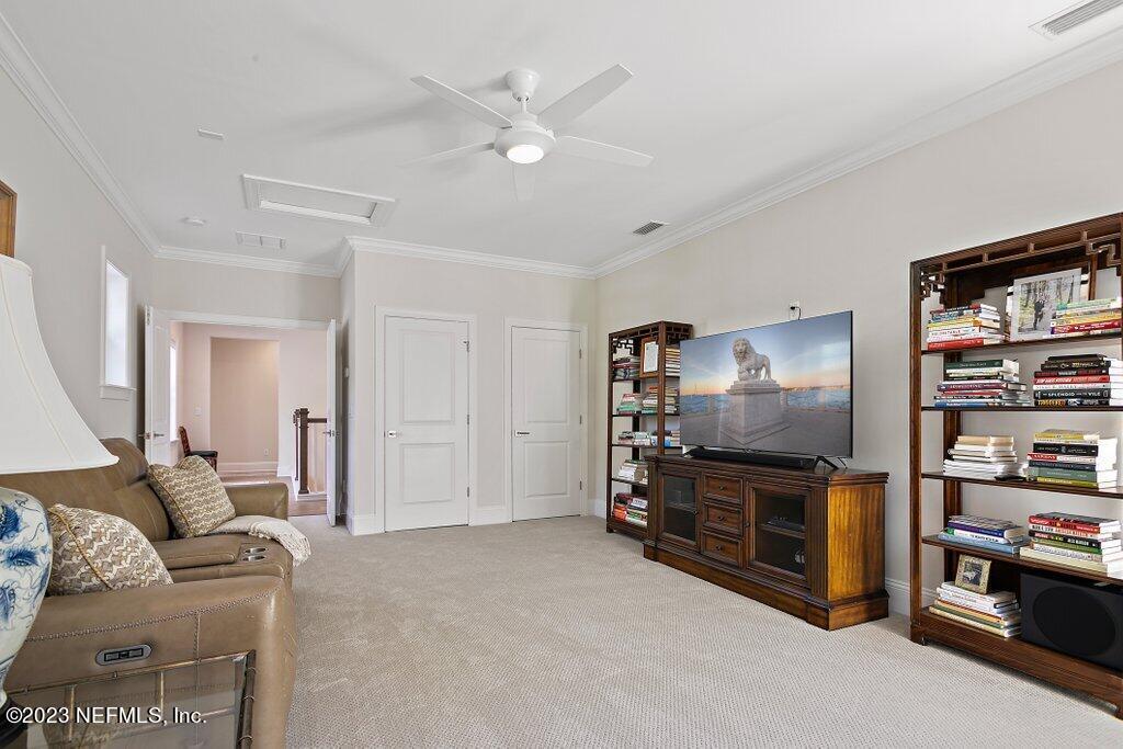 367 Shadow Cove St. Johns, FL 32259 - Photo 40 of 73 a living room with furniture and a flat screen tv