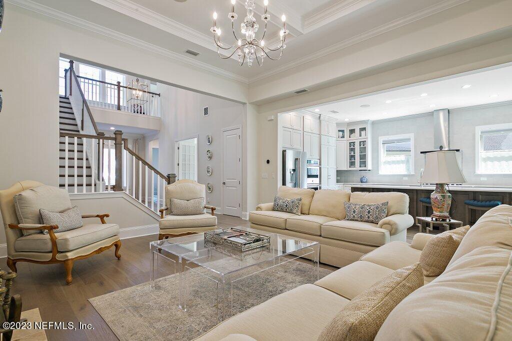 367 Shadow Cove St. Johns, FL 32259 - Photo 8 of 73 a living room with furniture or couch and a chandelier