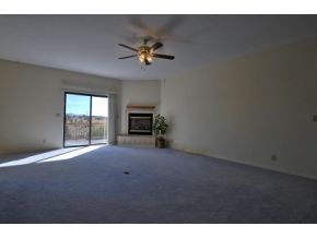 16901 Crossroads Ranch Road, Unit 2 Prescott, AZ 86305 - Photo 3 of 12 a view of empty room with a fireplace