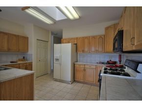 16901 Crossroads Ranch Road, Unit 2 Prescott, AZ 86305 - Photo 4 of 12 a kitchen with a refrigerator and a stove top oven