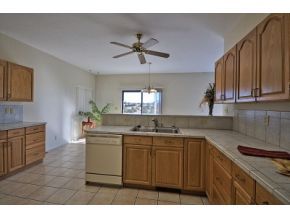 16901 Crossroads Ranch Road, Unit 2 Prescott, AZ 86305 - Photo 5 of 12 a kitchen with a sink stove and cabinets