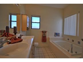 16901 Crossroads Ranch Road, Unit 2 Prescott, AZ 86305 - Photo 9 of 12 a bathroom with a tub sink and mirror