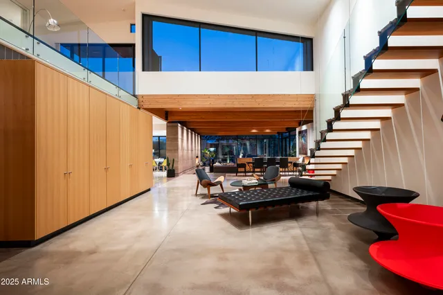a view of a livingroom with furniture and stairs