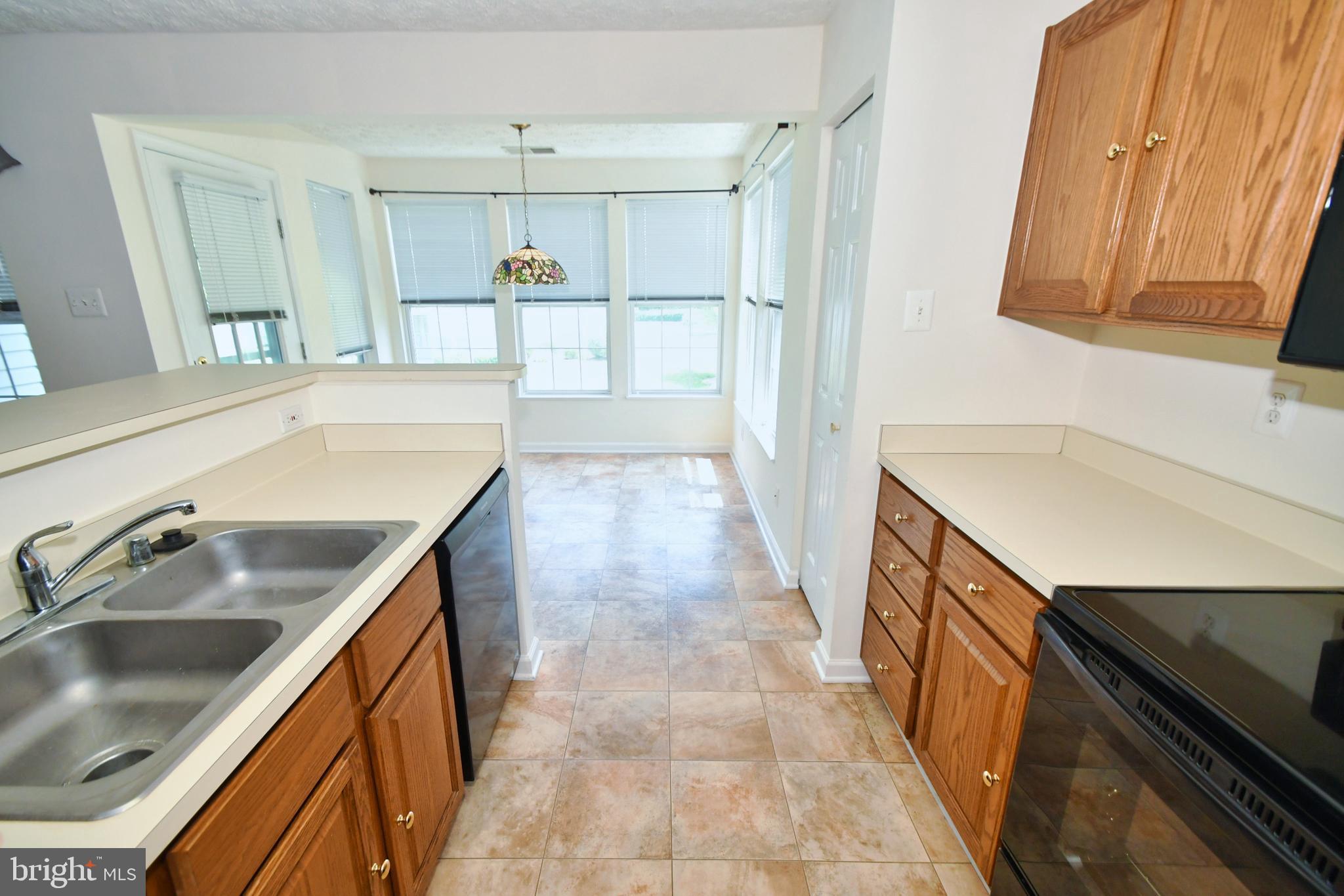 8343 Cypress Mill Road Baltimore, MD 21236 - Photo 13 of 35 Galley kitchen to table space