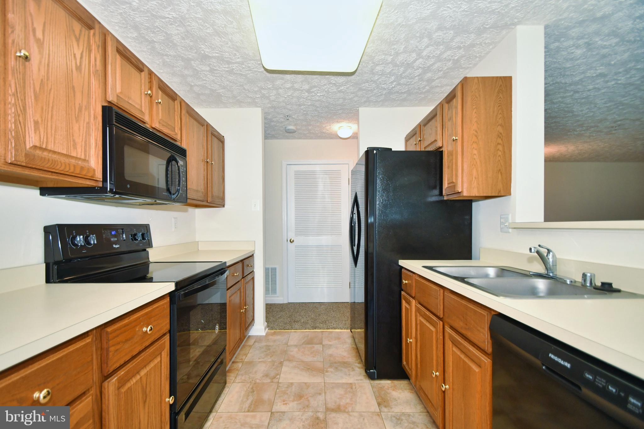 8343 Cypress Mill Road Baltimore, MD 21236 - Photo 10 of 35 Galley kitchen w/ table space