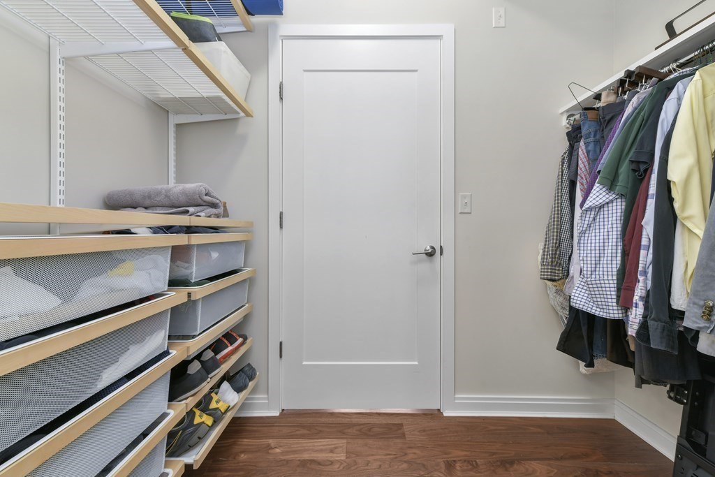 3531 Washington Street, Unit 226 Boston, MA 02130 - Photo 14 of 35 a view of walk in closet with clothes and shoes