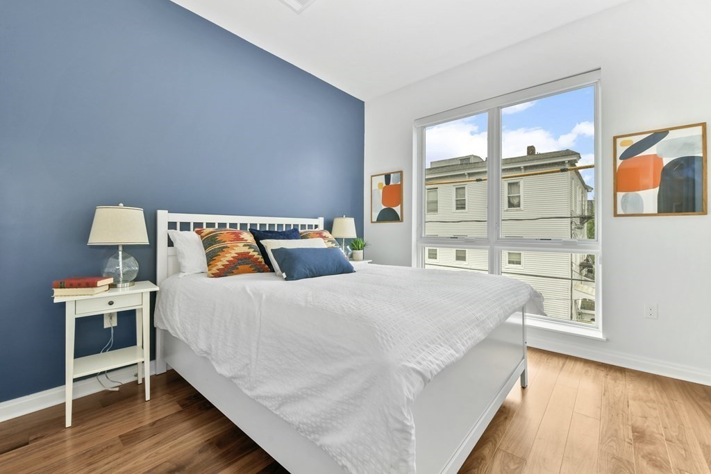 3531 Washington Street, Unit 226 Boston, MA 02130 - Photo 15 of 35 a bed room with a bed and a book shelf