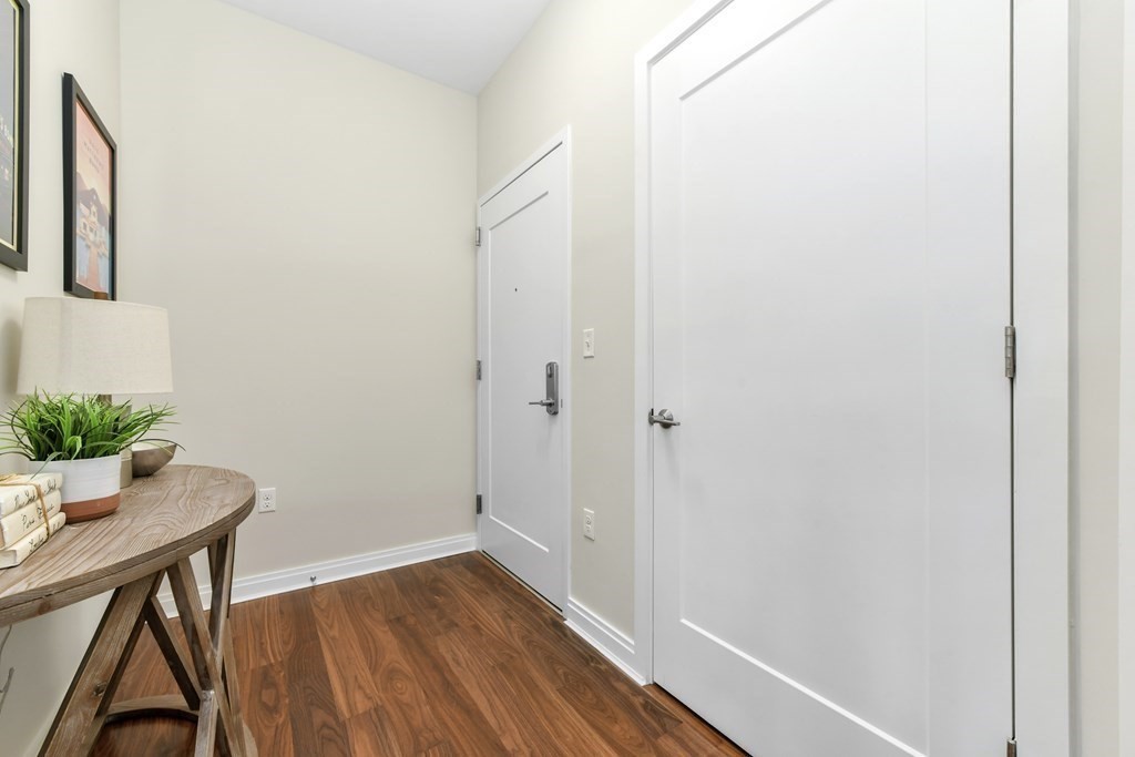 3531 Washington Street, Unit 226 Boston, MA 02130 - Photo 21 of 35 a view of room with wooden floor