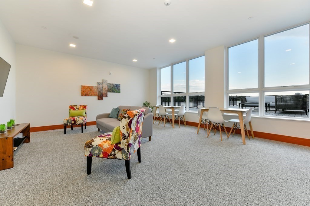 3531 Washington Street, Unit 226 Boston, MA 02130 - Photo 25 of 35 a living room with furniture and a table