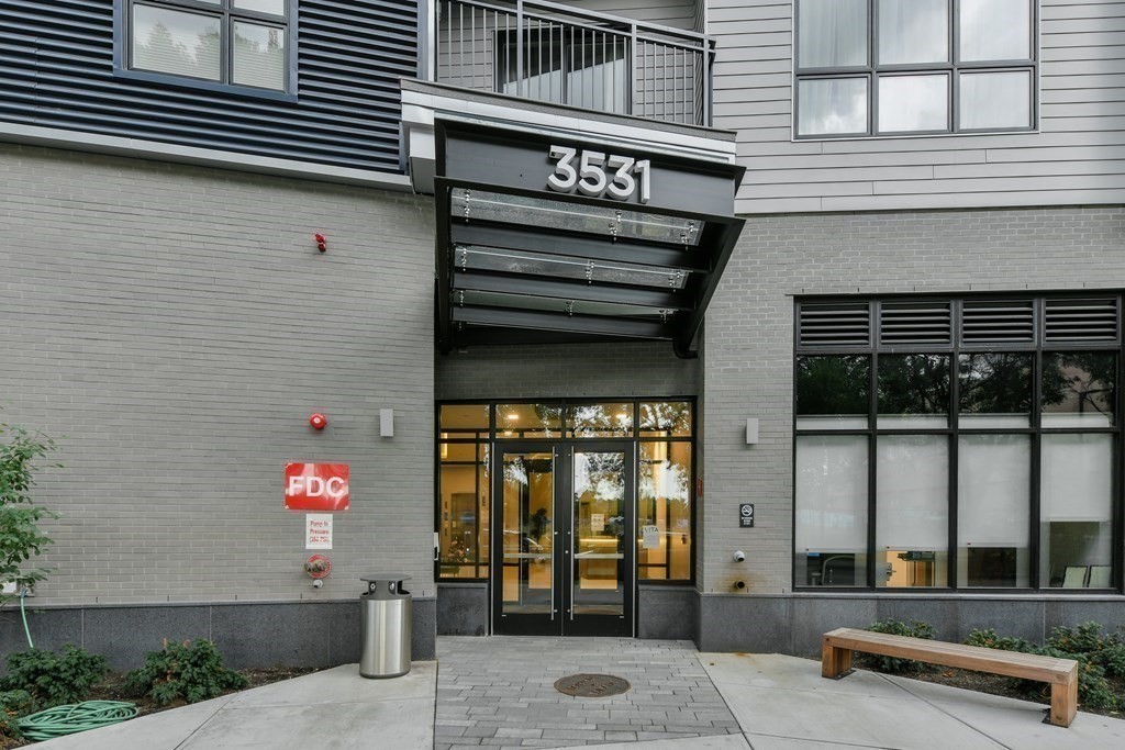 3531 Washington Street, Unit 226 Boston, MA 02130 - Photo 31 of 35 a front view of a building with glass windows