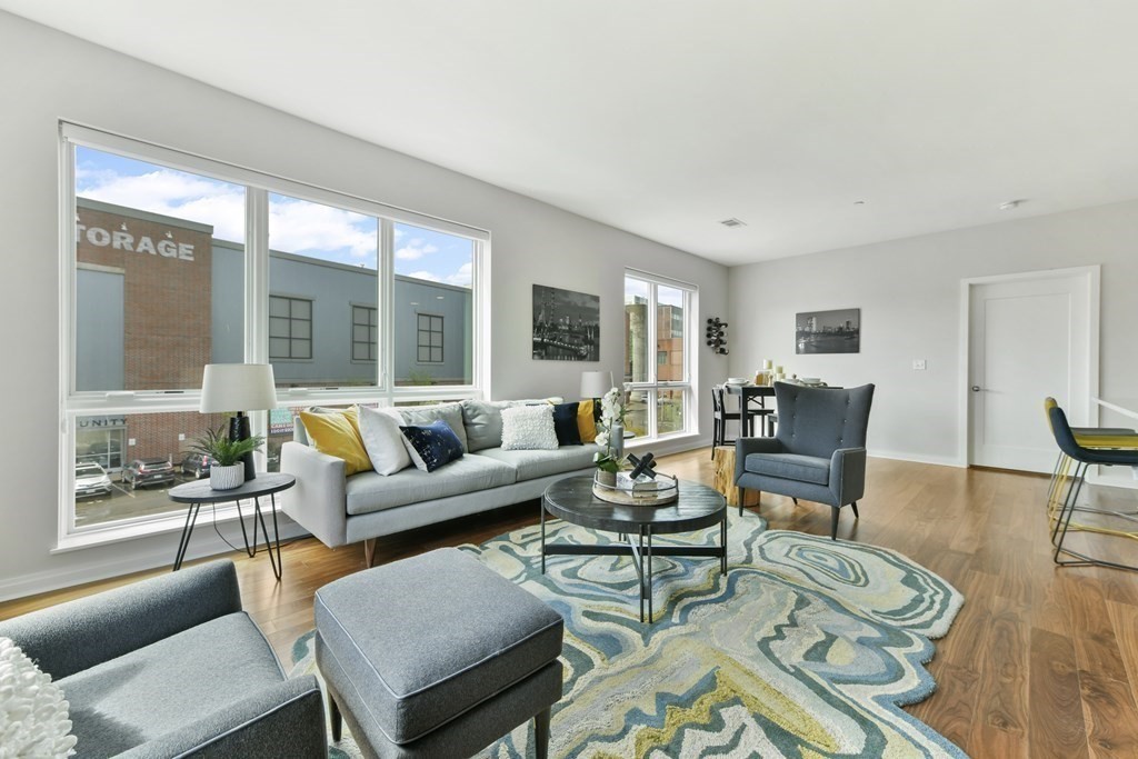 3531 Washington Street, Unit 226 Boston, MA 02130 - Photo 4 of 35 a living room with furniture and a large window