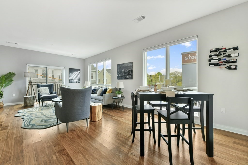 3531 Washington Street, Unit 226 Boston, MA 02130 - Photo 5 of 35 a view of a dining room with furniture window and wooden floor