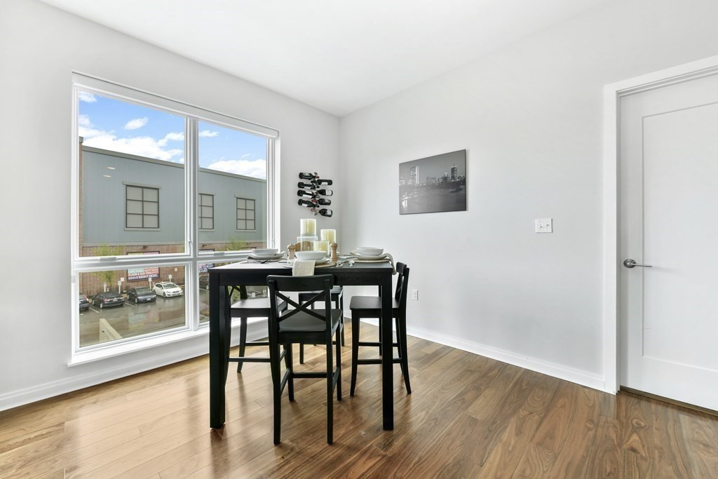 3531 Washington Street, Unit 226 Boston, MA 02130 - Photo 10 of 35 a view of a dining room with furniture and wooden floor
