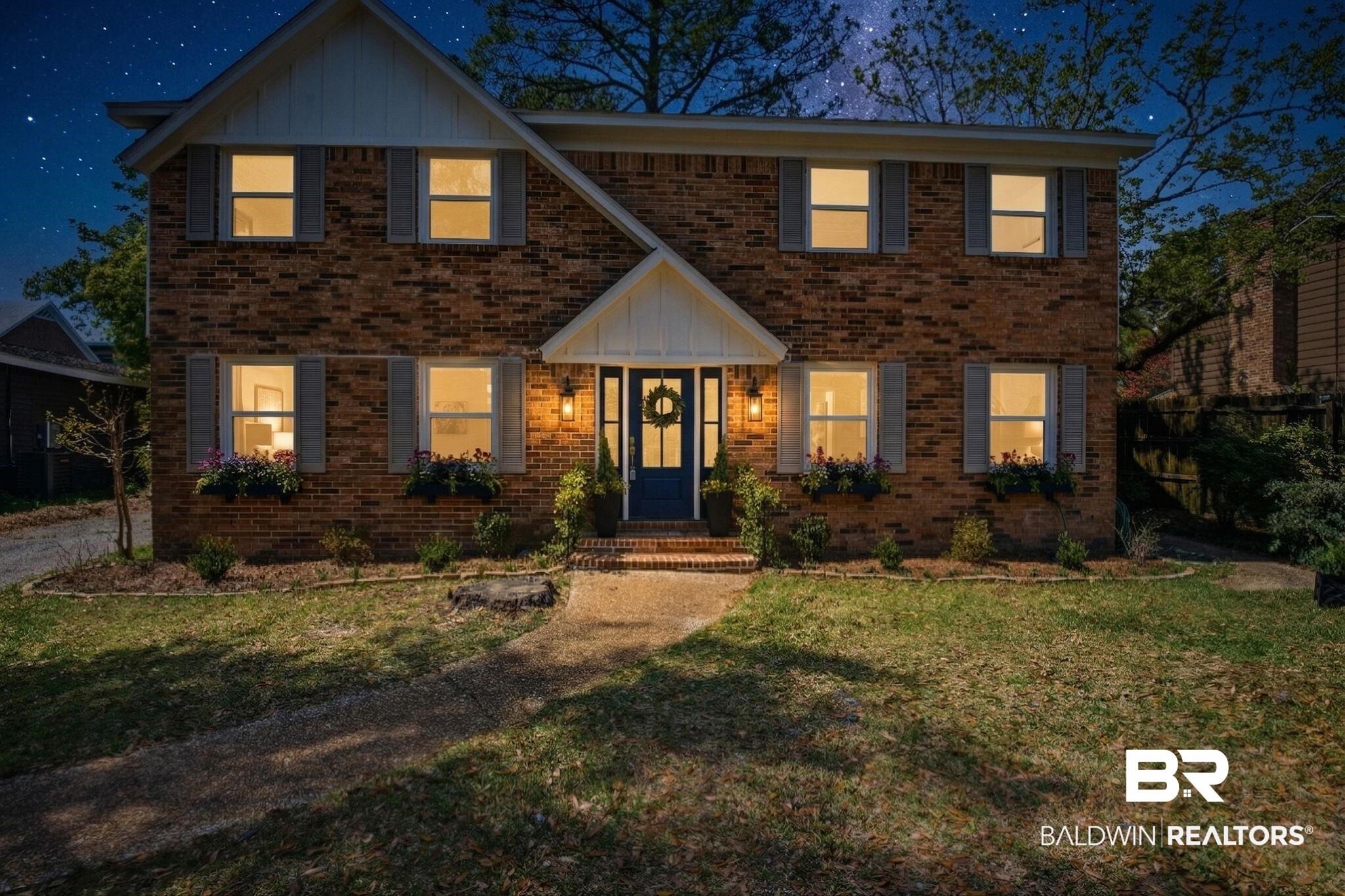 511 Wacker Lane North Mobile, AL 36608 - Photo 42 of 45 Traditional home with board and batten siding, brick siding, and a front yard