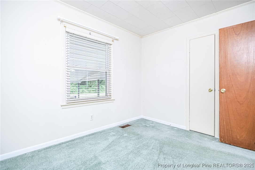 2067 Wade-Stedman Road Stedman, NC 28391 - Photo 19 of 29 an empty room with windows