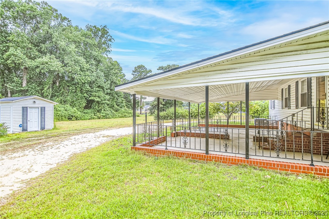 2067 Wade-Stedman Road Stedman, NC 28391 - Photo 2 of 29 a view of a house with a swimming pool