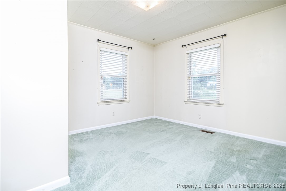 2067 Wade-Stedman Road Stedman, NC 28391 - Photo 21 of 29 an empty room with windows