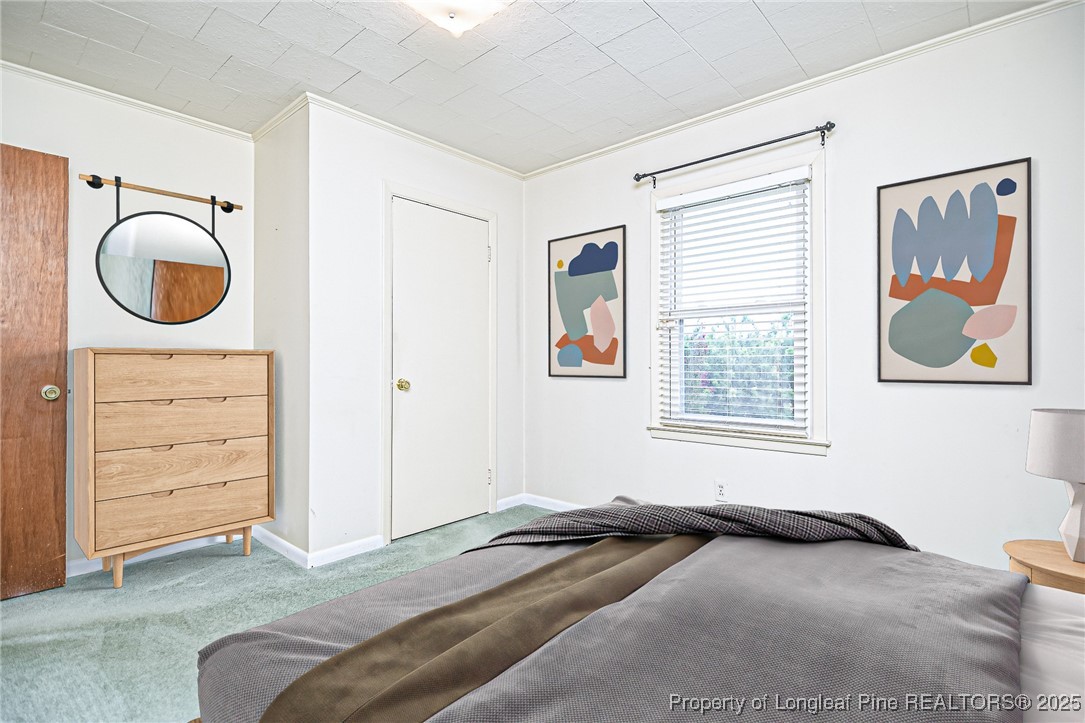 2067 Wade-Stedman Road Stedman, NC 28391 - Photo 22 of 29 a bedroom with a bed and a window