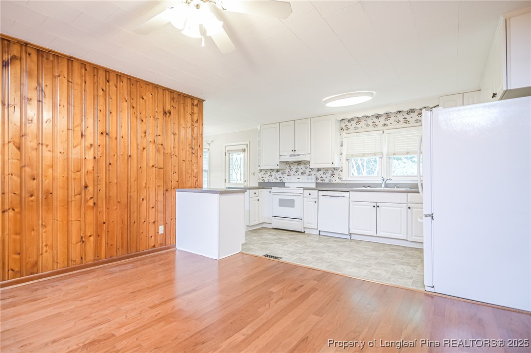 2067 Wade-Stedman Road Stedman, NC 28391 - Photo 5 of 29 a view of kitchen with wooden floor and electronic appliances