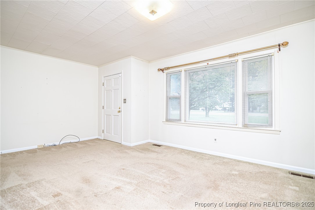 2067 Wade-Stedman Road Stedman, NC 28391 - Photo 10 of 29 an empty room with a empty space and windows