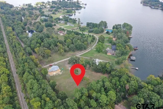 an aerial view of a red and white house