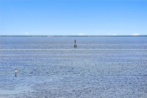 a kitchen with sink cabinets and dining table