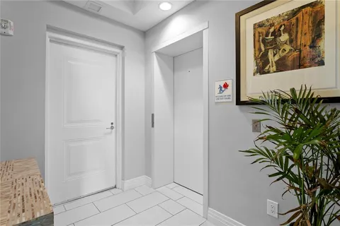 a bathroom with a double vanity sink mirror and shower