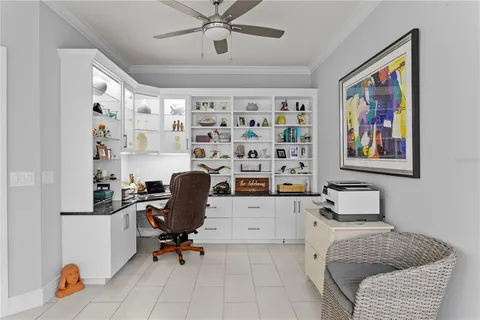 a large kitchen with a table and chairs
