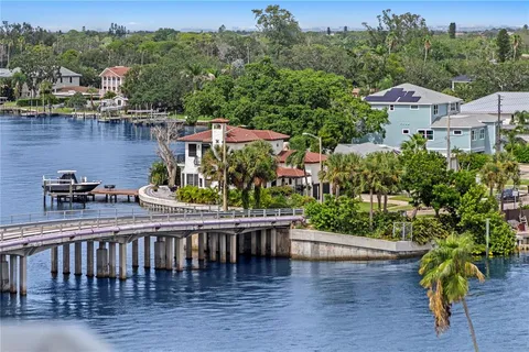 a living room with furniture pool table and a large window