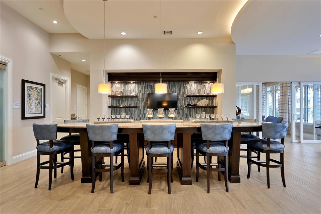 1325 Snell Isle Boulevard Northeast, Unit 711 St. Petersburg, FL 33704 - Photo 29 of 37 a large kitchen with a table and chairs