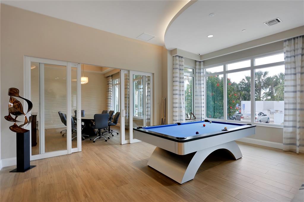 1325 Snell Isle Boulevard Northeast, Unit 711 St. Petersburg, FL 33704 - Photo 30 of 37 a living room with furniture pool table and a large window