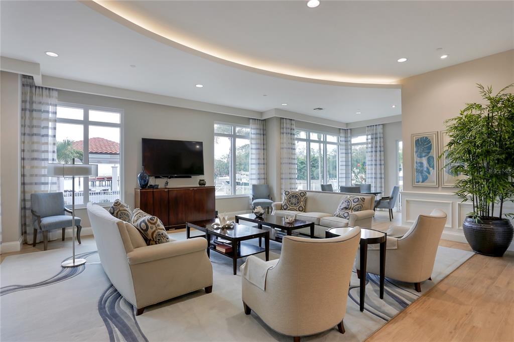 1325 Snell Isle Boulevard Northeast, Unit 711 St. Petersburg, FL 33704 - Photo 31 of 37 a living room with furniture and a flat screen tv