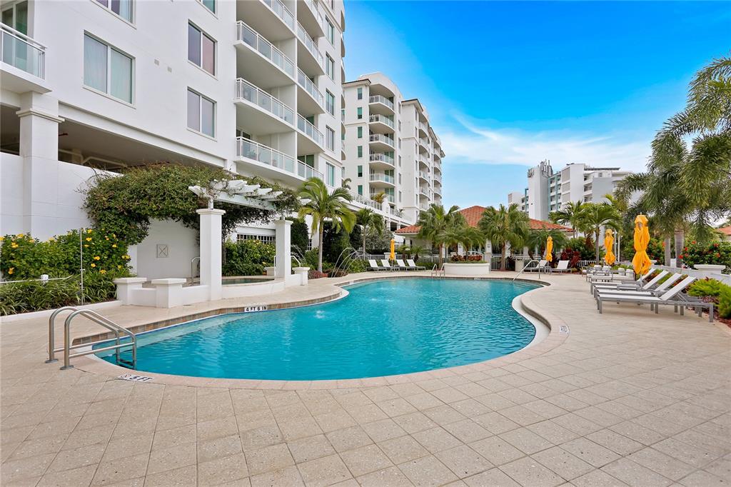 1325 Snell Isle Boulevard Northeast, Unit 711 St. Petersburg, FL 33704 - Photo 36 of 37 a view of a swimming pool with outdoor seating
