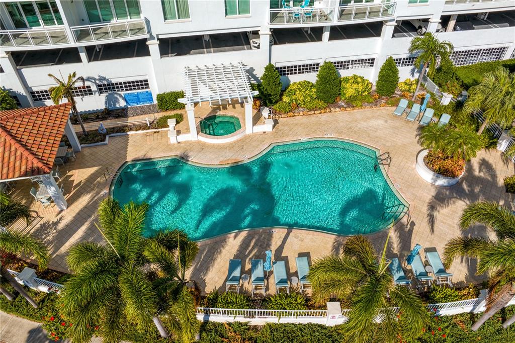 1325 Snell Isle Boulevard Northeast, Unit 711 St. Petersburg, FL 33704 - Photo 5 of 37 a view of a swimming pool with a patio