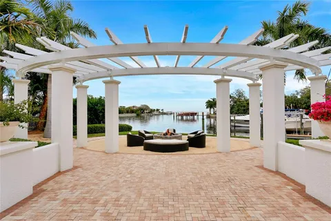 a outdoor living space with patio furniture and a floor to ceiling window