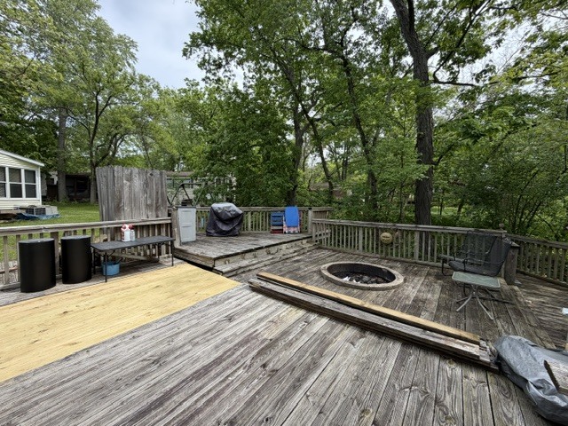 2795 East 28th Road Marseilles, IL 61341 - Photo 18 of 58 a view of a balcony with wooden floor and outdoor seating