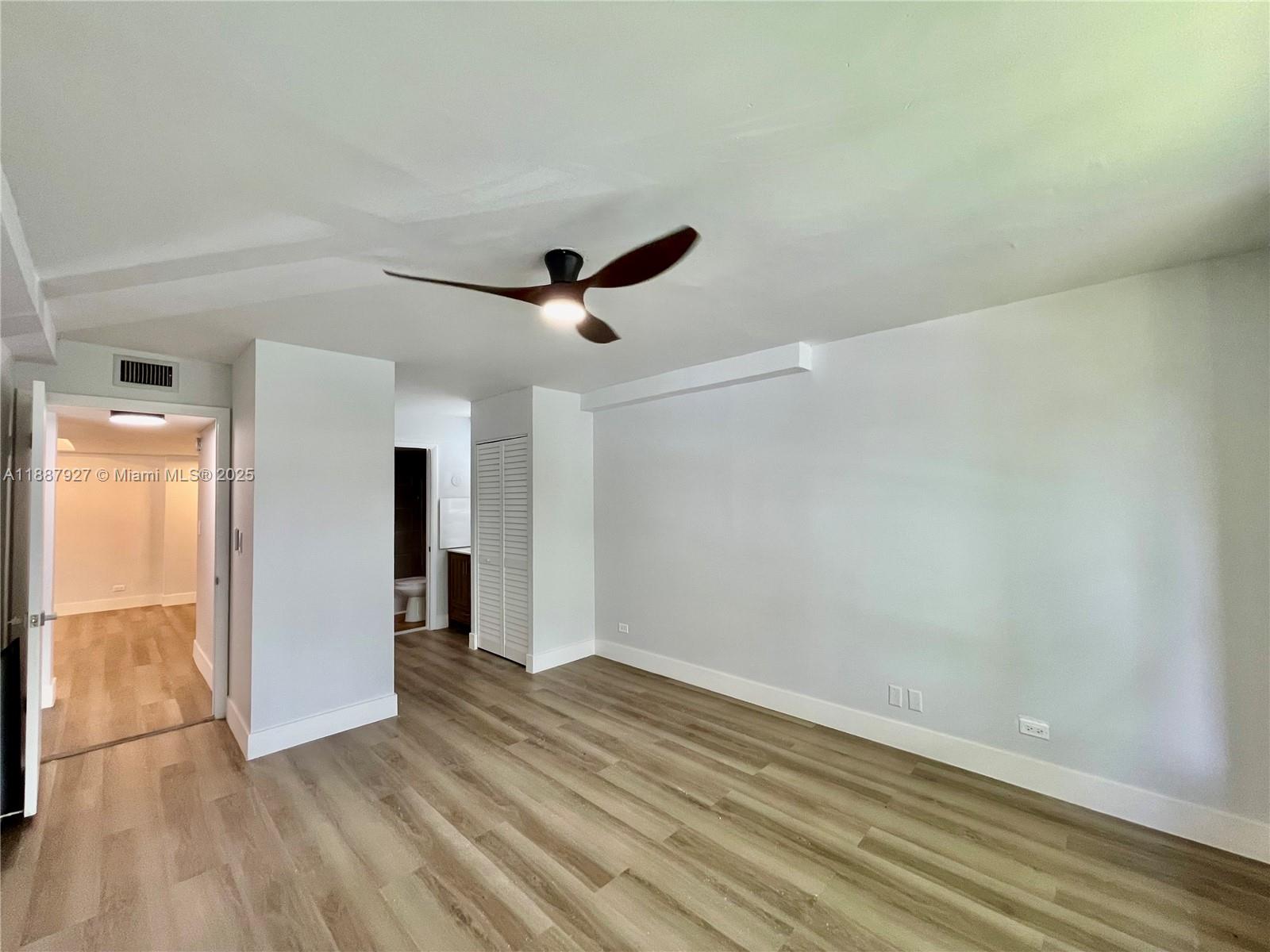3680 Inverrary Drive, Unit 2B Lauderhill, FL 33319 - Photo 8 of 12 wooden floor in an empty room