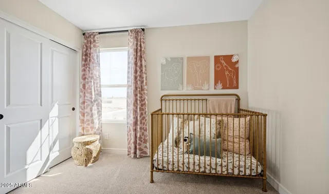 a bedroom with a bed and a night stand