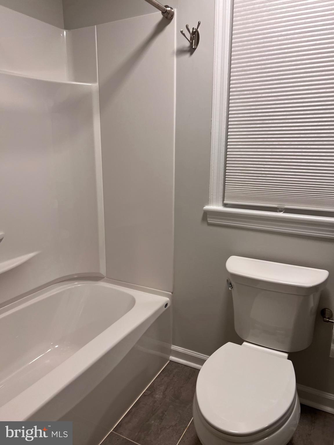 328 Bryan Place Hagerstown, MD 21740 - Photo 15 of 24 a white toilet sitting next to a bathtub