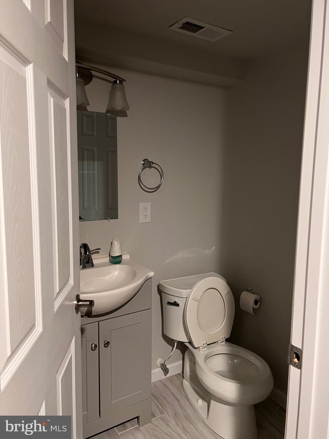 328 Bryan Place Hagerstown, MD 21740 - Photo 17 of 24 a bathroom with a toilet a sink and a mirror