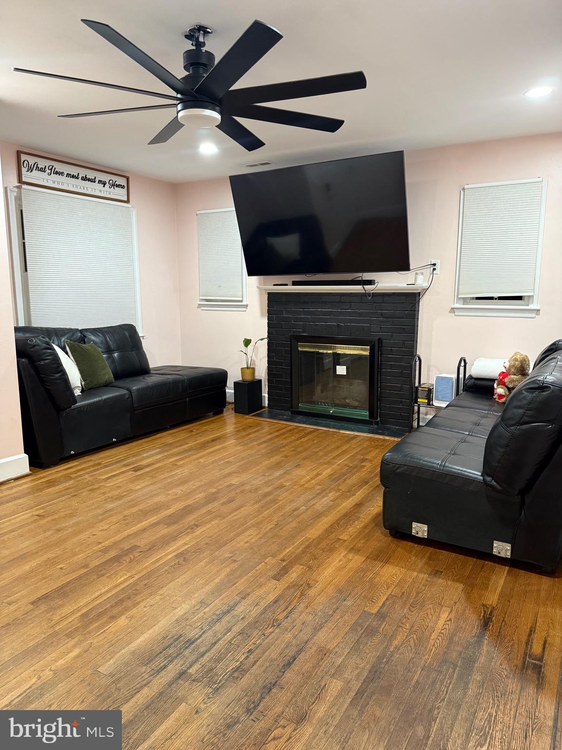 328 Bryan Place Hagerstown, MD 21740 - Photo 3 of 24 a living room with furniture a fireplace and a flat screen tv