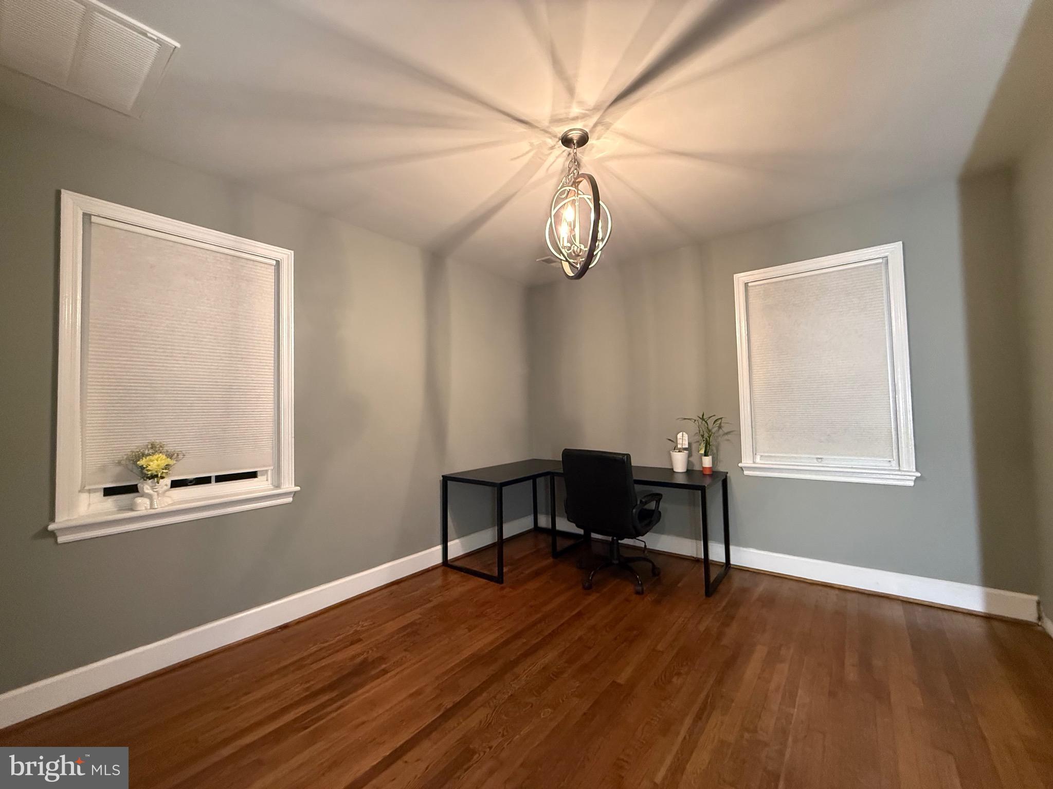 328 Bryan Place Hagerstown, MD 21740 - Photo 10 of 24 a view of room with window wooden floor and a ceiling fan